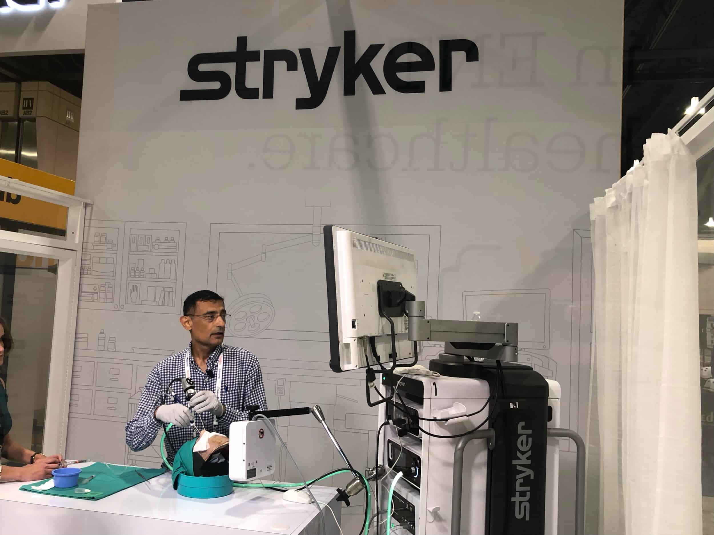 Dr. Ashley Sikand demonstrating endoscopic equipment at a professional education event