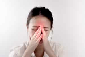 woman has a pain in nose or sinusitis sinus infection